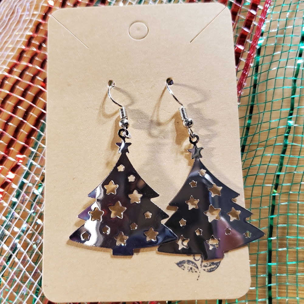 Striking Silver Cut out Christmas Trees with Very Intricate cut out Stars